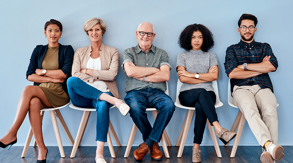 A group of people sitting on chairs