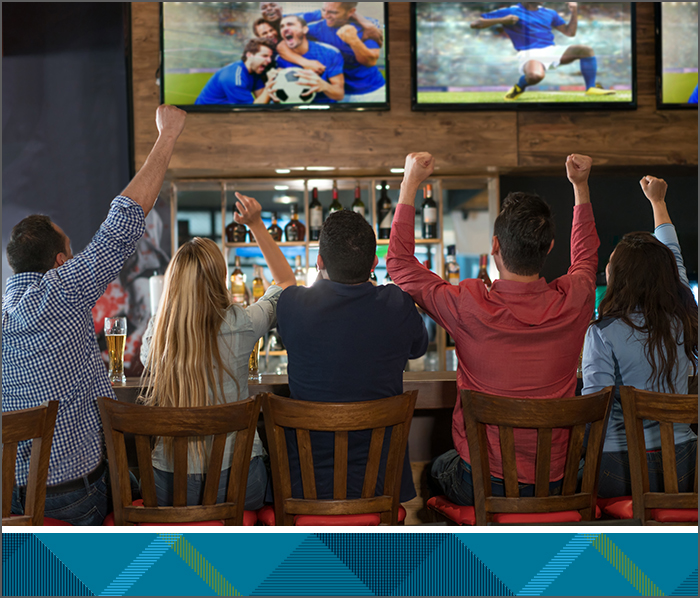 People at a bar watching Tbaytel TV