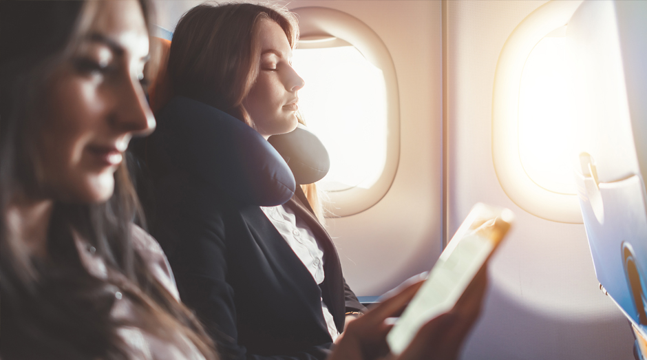 A woman resting on an airplane