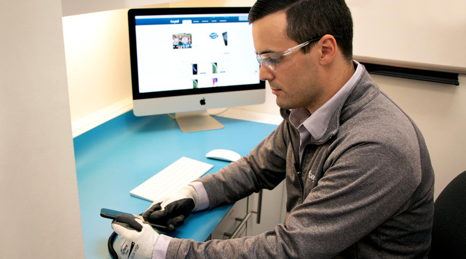 A certifiect technician repairing a phone