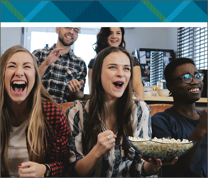 A group of people watching TV together