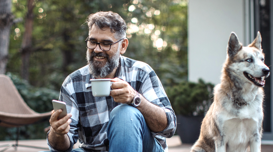 Man adding extra features and add-ons to his cell phone plan while at camp